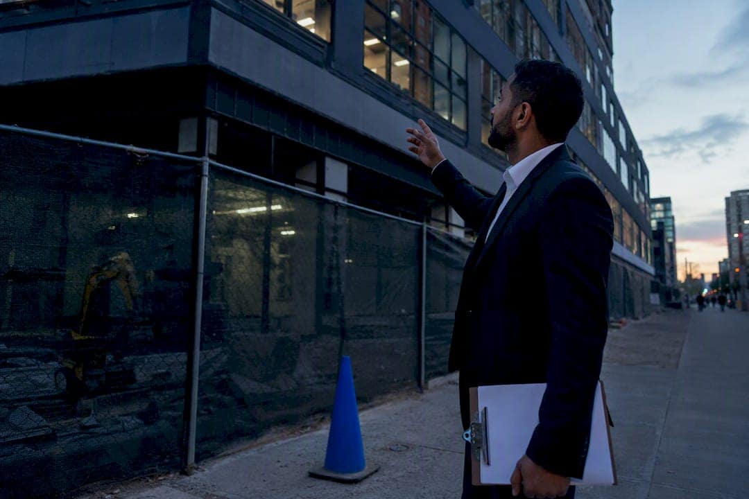 Investor walking commercial property exterior