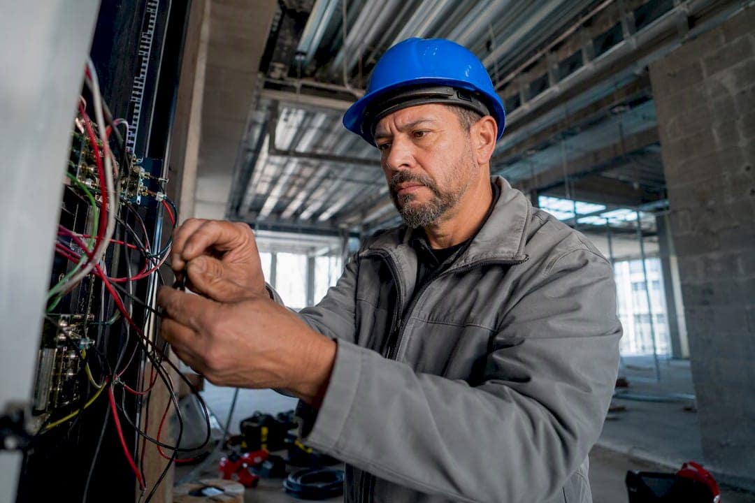 Business owner wiring electrical connections onsite