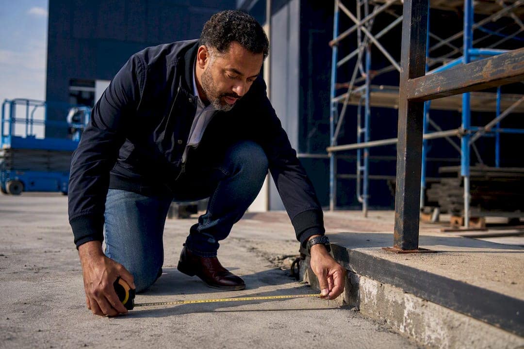Investor measuring structure on property site